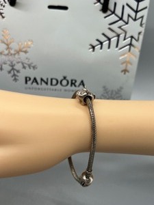 lot 437 image: Pandora Sterling Bracelet with Pandora Spot the Dog Charm