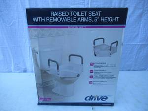 lot 22 image: Home Medical Supply Raised Toilet Seat with Removable Arm Rests. Appears unused in box and plastic wrap.