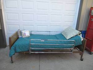 lot 54 image: Drive adjustable power Twin Hospital Bed