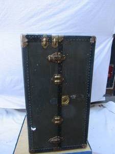 lot 11 image: Antique Travel Well  Steamer Trunk Wardrobe Luggage filled with childrens dress up clothes and costume accessories. Oshkosh, Wisconsin.