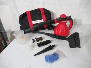 lot 77 image: Scunci Hand Held Steamer in original bag with tools.