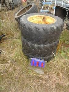 lot 104 image: Well used skid steer tires filled 10.50 x 15. As shown.