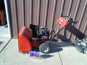 lot 105 image: Yard Machine 22 snow blower. Used condition. Tested & works. As shown.