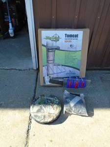 lot 121 image: Tom Cat hunting tree stand with extra seat & harness. Used a few times. As shown.
