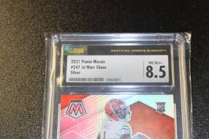 lot 5 image: 2021 Mosaic Silver Prizm JaMarr Chase #247 CSG 8.5 Rookie Card