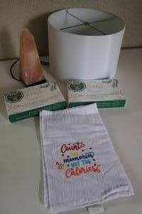 lot 65 image: One Counts The Memories Not The Calories Decorative Towel--Two Boxes Of Tia & Fey Organic Bamboo Wash Cloths-Lamp Shade For Nightstand Lamp-Salt Table Lamp
