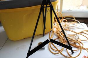 lot 100 image: 16   34 Wide Measuring Tape-Heavy Extension Cords-Tripod-Yellow Rubbermaid Tote With Cover