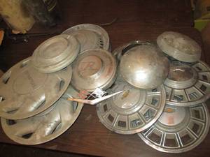 lot 206 image: Several hubcaps and a 59 CHEVROLET ...