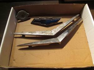 lot 217 image: Vintage Chevy emblems (see photos )...