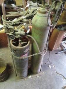 lot 9 image: Oxyacetylene cutting torch on doll...