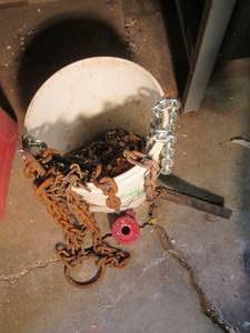 lot 69 image: Bucket of various chains and more (...