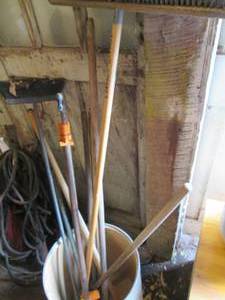 lot 73 image: Bucket with 2 brooms, large metal c...