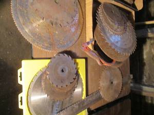 lot 120 image: Many large circular saw blades, han...