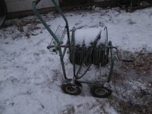 lot 288 image: Portable hose roller, hose and spri...