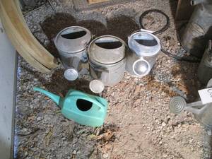lot 601 image: 3 metal and 1 plastic watering cans...