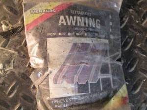lot 658 image: Retractable awning, new in pkg...