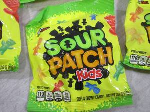 lot 141 image: (B-1) 12 Bags Sour Patch Kids Candy...