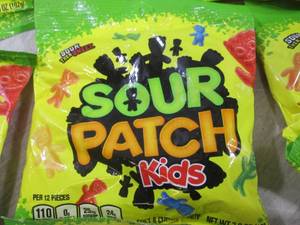 lot 143 image: (B-1) 12 Bags Sour Patch Kids Candy...