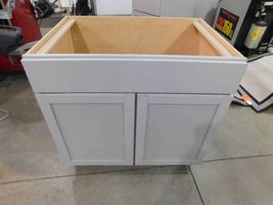 lot 41 image: New - Hampton Bay Courtland Shaker Assembled 36 in. x 34.5 in. x 24 in. Stock Sink Base Kitchen Cabinet in Sterling Gray Finish