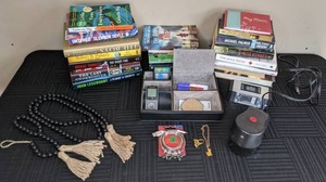 Assortment of Books, Electric Pencil Sharpener, ClockRadio, Desk Organizer, Sports Radio, & More