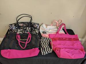 A Collection of (6) Handbags Including Victorias Secret, Express, Express Design Studio and More
