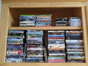 lot 62 image: Assorted DVDs, CDs, Blu Rays, and PC Video Games - Disney Classics, The Silence of the Lambs, The Little Rascals, The Godfather, Bob Marley, and more
