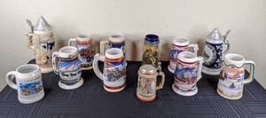 lot 60 image: (12) Assorted Beer Steins, Budweiser Holiday Steins