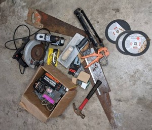 lot 40 image: Mixed Tool Lot  Stanley Hard Tooth Saw, Makita Cordless Drill, Skilsaw 5150 Circular Saw, Hammer, Misc. Hardware, Screws, and More
