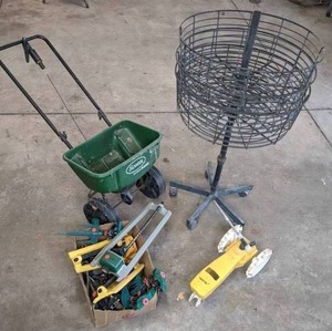 lot 41 image: Multi-Tier Rolling Wire Basket on Stand, Collection of Lawn Sprinklers, and Scotts Fertilizer Spreader