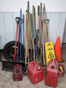 lot 38 image: Mixed Lot of Garage Items  Spare Auto Tire, (4) Gas Cans, Safety Cone and Floor Signs, Multiple Yard and Garden Tools