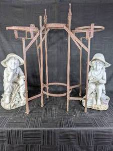 lot 32 image: Pair of Ceramic Garden Statues Little Boy and Girl, Plus Wrought Iron Plant Stand