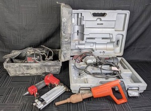 lot 23 image: Assortment of Tools Remington power Actuated Tool, Powermate 2 in 1 Air NailerStapler, Rotozip Spiral Saw, & SearsCraftsman Belt Sander