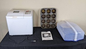 lot 134 image: Toast Master Bread Box Bread Maker, Muffin Baking Pans, Etc.