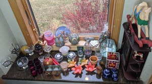 lot 118 image: Large Collection of Candles, Glass and Ceramic Candle Holders, Small Curio Cabinet, Small Wooden Rocking Horse, and More