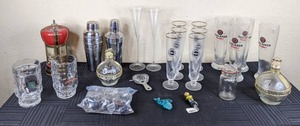 lot 89 image: Assortment of Drink MixersShakers, Winer Stoppers, Vintage Warsteiner & Paulaner Pilsner Glasses, Bottle Pourers and More