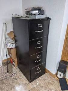 lot 140 image: 4-Drawer Black File Cabinet, Magnavox DVD Player and IRobot Roomba Vacuum