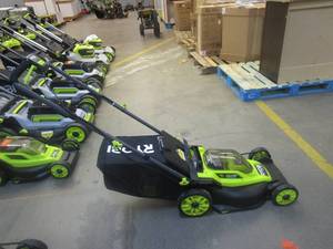 lot 409 image: RYOBI ONE HP 18V Brushless 16 in. Cordless Battery Walk Behind Push Lawn Mower with (1) 4.0 Ah Battery and (1) Charger (NICE CONDITION)