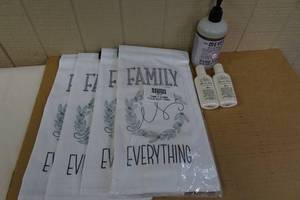 lot 47 image: 6 Flour Sack Kitchen Towels With Hand Soap and Lotion