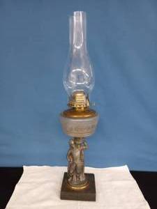 lot 11 image: Antique Figural Composite Oil Lamp