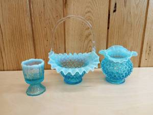lot 25 image: Vintage Fenton Blue Opalescent Hobnail Vase, Basket, and Daisy Candle Holder