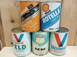 lot 56 image: Assortment of Vintage 1 Quart  Oil Cans Motorcraft, Rotella, Valvoline, and Phillips 66