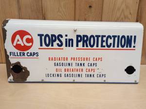 lot 83 image: Vintage AC Tops in Protection Filler Caps Metal Automotive Display Cabinet