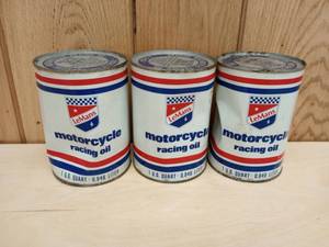 lot 100 image: Three LeMans Special Motorcycle Racing Oil Cans