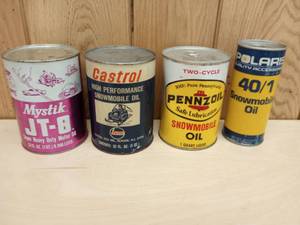 lot 102 image: Mystic JT-8, Castrol, Pennzoil, and Polaris Snowmobile Oil Cans