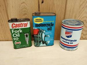 lot 103 image: Vintage Motorcycle Oil Cans Union Carbide, LeMans, and Castrol Fork Oil