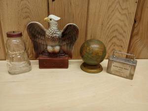 lot 127 image: Assorted Vintage Coin Banks Snow Crest Bear, World Globe, American Eagle, and Northside Bank