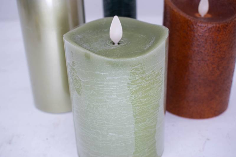 lot 201 image: 4 Luminara Green, Teal, and Orange Flameless Candles
