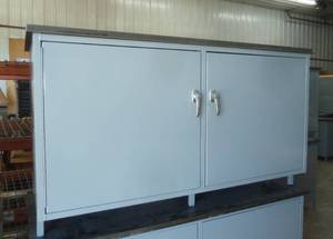 lot 7 image: Warehouse storage cabinet with formica top 58x28x33 tall, 2 doors w adjustable inside shelf, like new