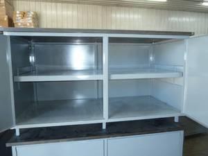 lot 8 image: Warehouse storage cabinet with formica top 58x28x33 tall, 2 doors w adjustable inside shelf, like new