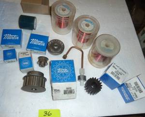 lot 36 image: Group of new idlers, gears, wire